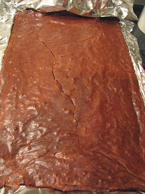 sheet pan of ina garten's outrageous brownies cooling out of the oven.