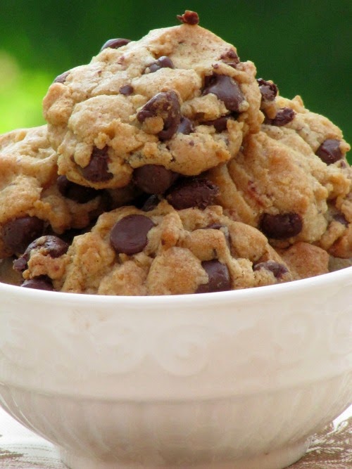 White bowl filled with browned butter chocolate chip cookies