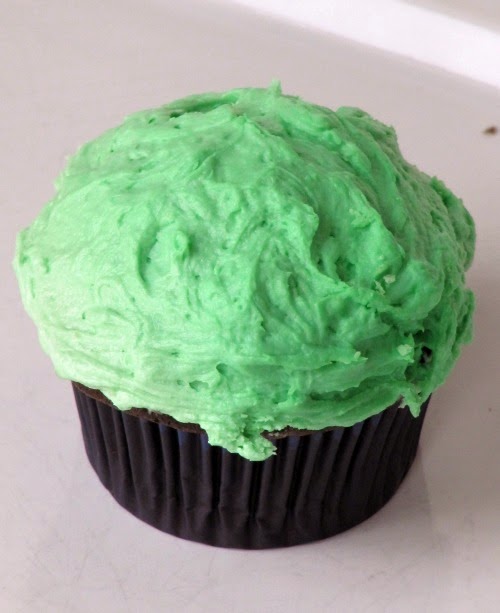 green cupcake made with guinness chocolate cupcake batter for st patricks day.