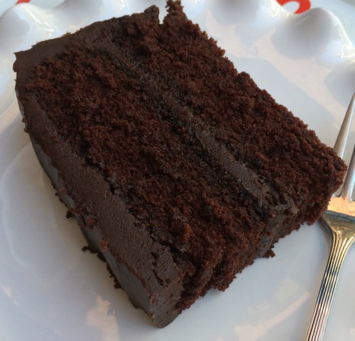 overhead view of wellesley chocolate cake on a white plate.