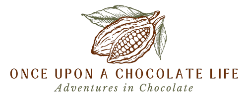 logo with a cacao pod that reads once upon a chocolate life.