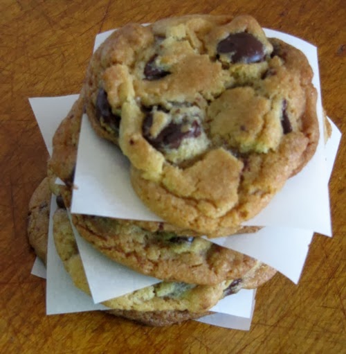 top view of a stack of thick toffee-colored The Best Chocolate Chip Cookies Ever by jacques Torres.