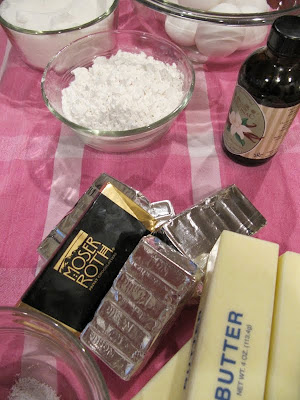 Ingredients for making Brownies From Once Upon A Tart such as butter, chocolate bars, vanilla, flour and sugar,