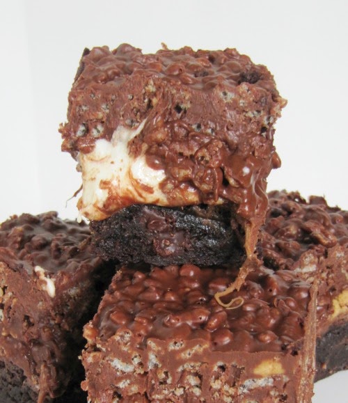 Closeup image of rich gooey rolo  marshmallow peanut butter brownies against a white background.