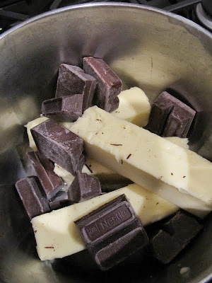 Chocolate and butter in a mixing bowl for making Brownies From Once Upon A Tart.