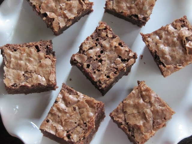Overhead veiw of several Brownies From Once Upon A Tart shown on a white platter,