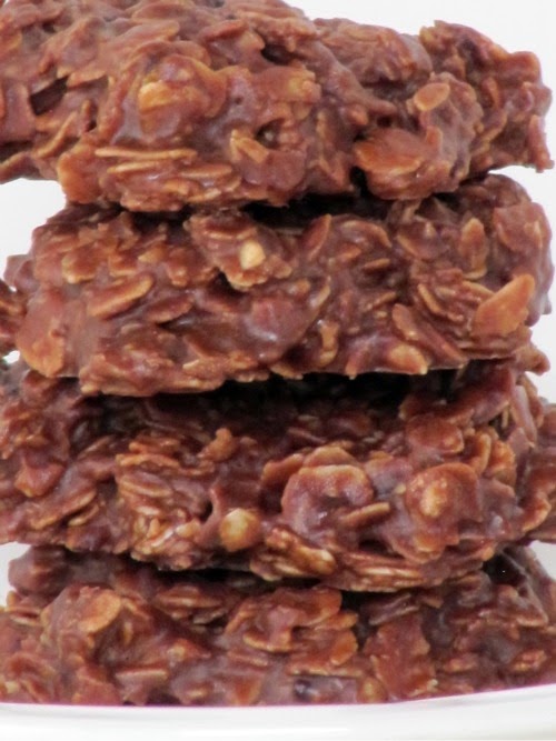 A close up image of a stack of chocolate peanut butter oatmeal  no bake cookies.