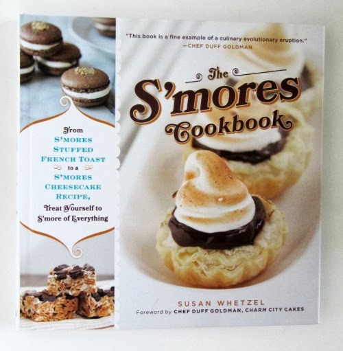 A photo of The S'mores Cookbook by Susan Whetzel that shows images of s'mores flavored desserts, including S'Mores Oatmeal.